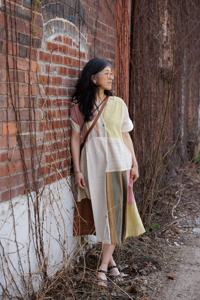 This dress is made in collaboration between Erica Kim @ahistoryofarchitecture and World of Crow, This dress has woven patches of different desert colors, it is made with handwoven fabric