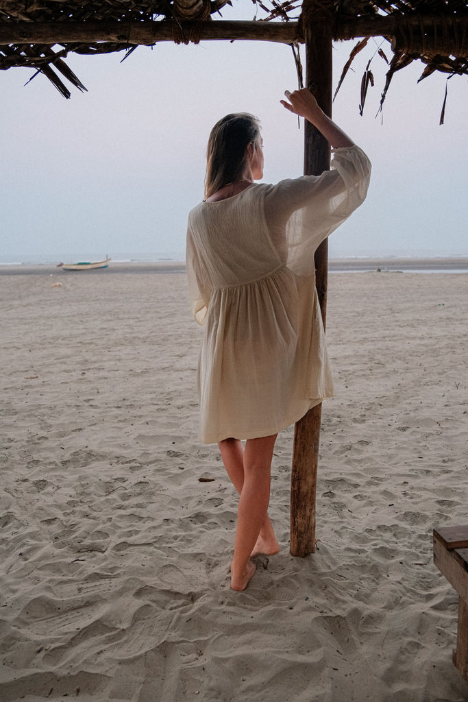 Romantic dress, day at a beach waering world of crow, Erica Kim in collaboration with World of Crow, White color dress, sustainable clothing