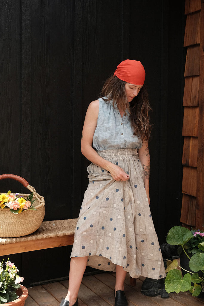 This a gathered skirt with a vintage look. The polka dots add the charm to the skirt, the colors are subtle and soothing to the eyes. The smocked waist gives it an easy closure and comfortable to wear all day.
