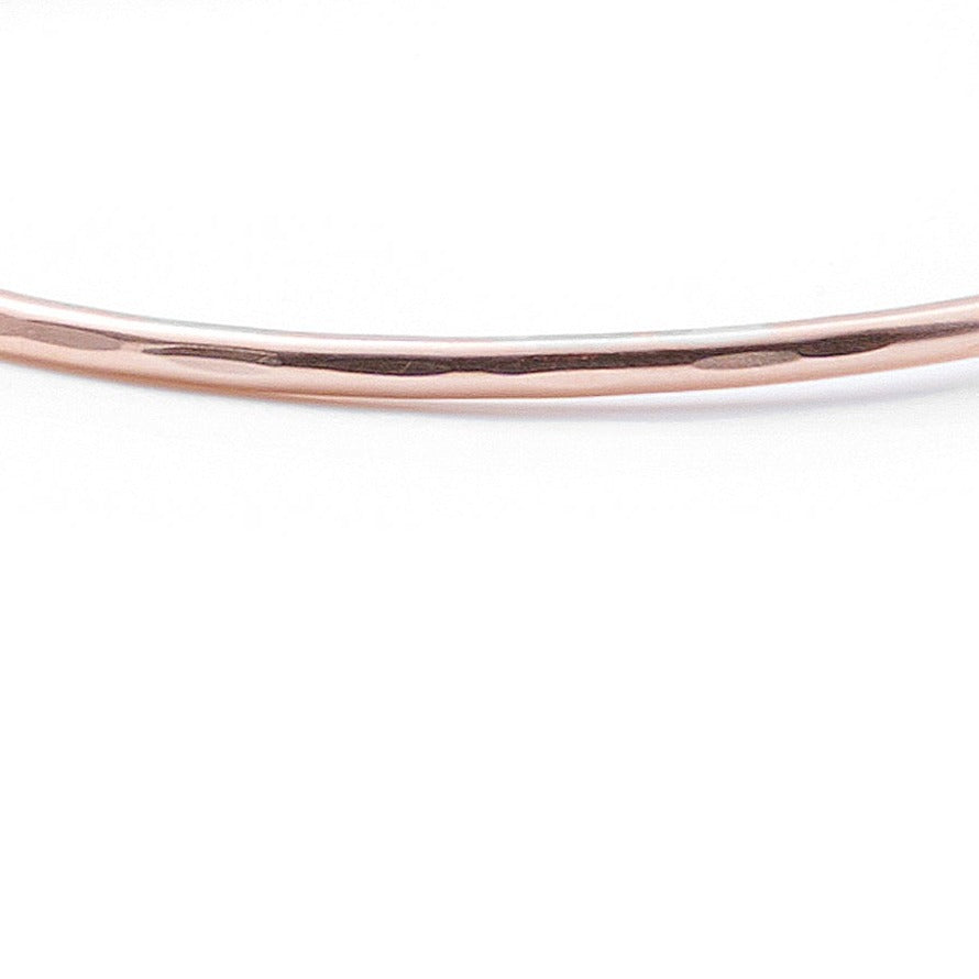 Introducing a beautifully crafted rose gold cuff bracelet, designed with two delicate wires. Available in both smooth and hammered finishes, this elegant piece is offered in sizes ranging from X-Small to Large, with custom sizing options to ensure a perfect fit.