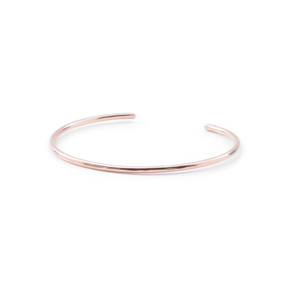 Introducing a beautifully crafted rose gold cuff bracelet, designed with two delicate wires. Available in both smooth and hammered finishes, this elegant piece is offered in sizes ranging from X-Small to Large, with custom sizing options to ensure a perfect fit.