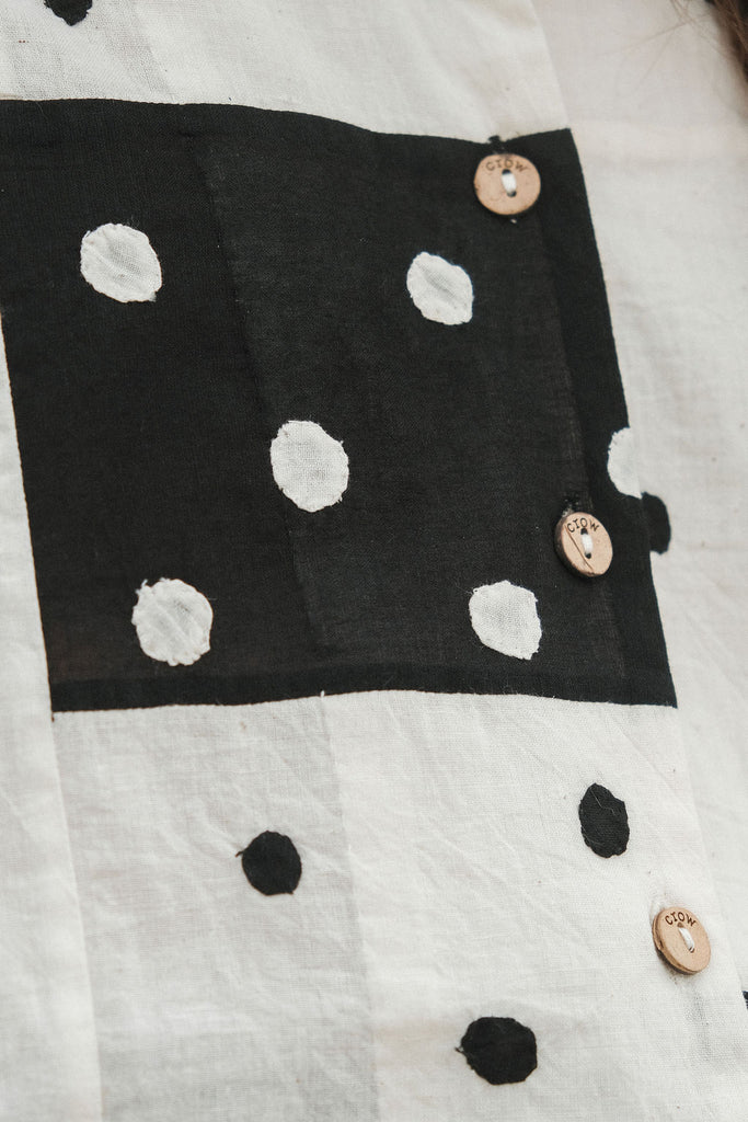 Details of the patchwork shirt. The Black & White polka dots offer a visual contrast and the rich fabric gives it the hand crafted touch.