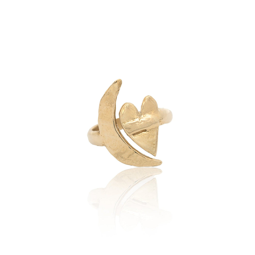 Introducing the Artemis Gold Moon and Heart Ring, inspired by the goddess of the hunt and moon. Handmade in Southern California, this ring features textured crescent moon and heart motifs, adding a celestial touch to your look. Crafted from recycled metal, it's available in recycled brass, gold-plated brass, or 14k solid gold, and comes in adjustable sizes S/M (6-8) and M/L (8-10). Please note, sterling silver is available in a separate listing