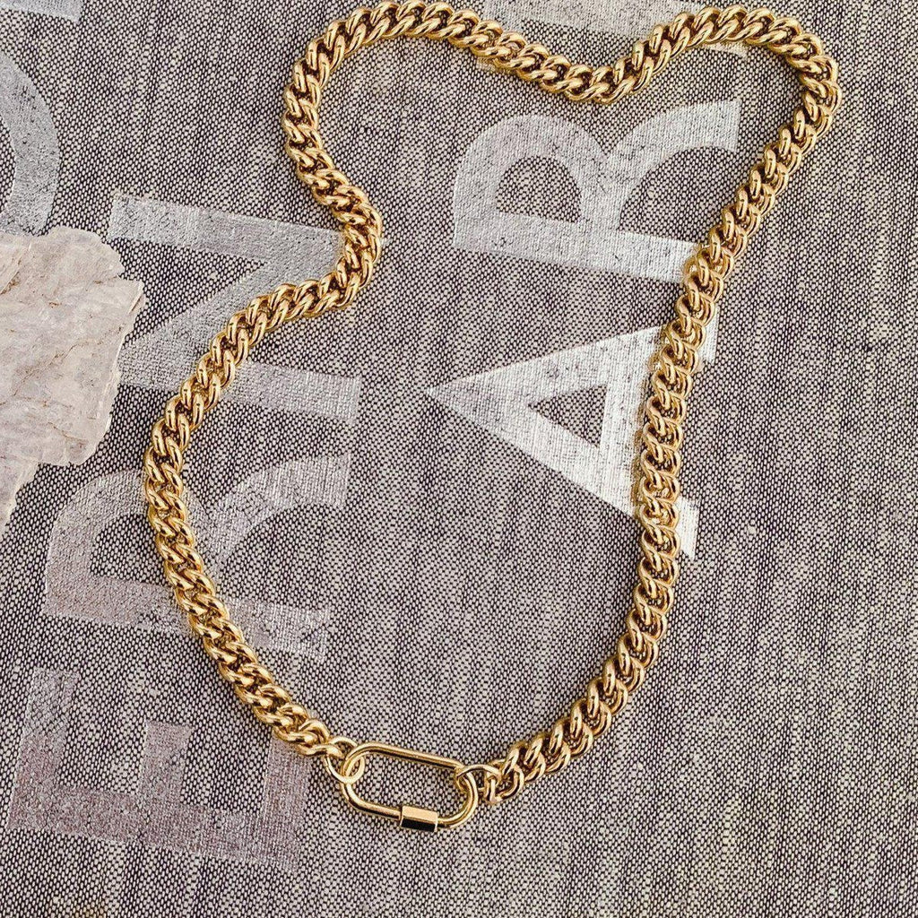 Introducing our bold and versatile gold-plated brass chain bracelet, featuring a chic carabiner closure for a touch of modern elegance. This bracelet boasts a 17" chain with an additional 1.5" carabiner, totaling 18.5" in length. Expertly crafted, it combines style and functionality, adding a sophisticated edge to any outfit