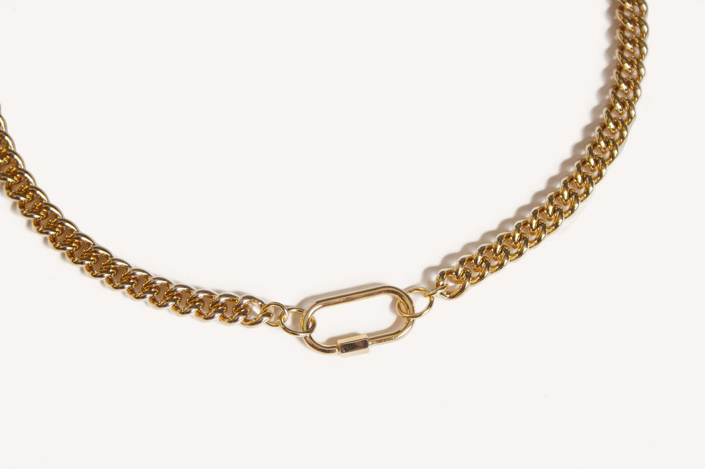 Introducing our bold and versatile gold-plated brass chain bracelet, featuring a chic carabiner closure for a touch of modern elegance. This bracelet boasts a 17" chain with an additional 1.5" carabiner, totaling 18.5" in length. Expertly crafted, it combines style and functionality, adding a sophisticated edge to any outfit