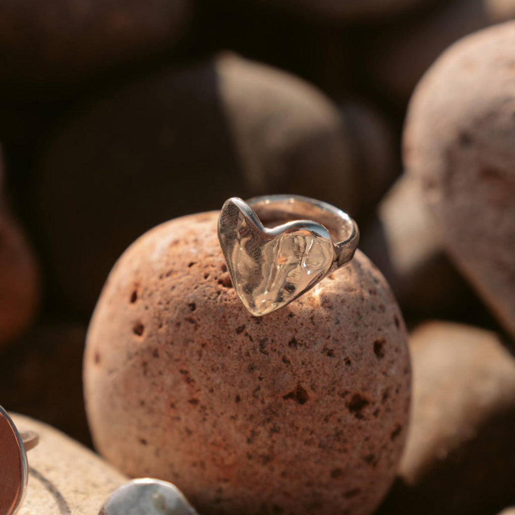 Introducing the Eros Heart Ring, a luxurious signet style crafted from an original wax sculpture and cast in recycled sterling silver. Named after the Greek god of love, this chunky ring is available in brass, gold plated, and 14k gold. Each piece is made to order with meticulous care, perfect for elevating any occasion.