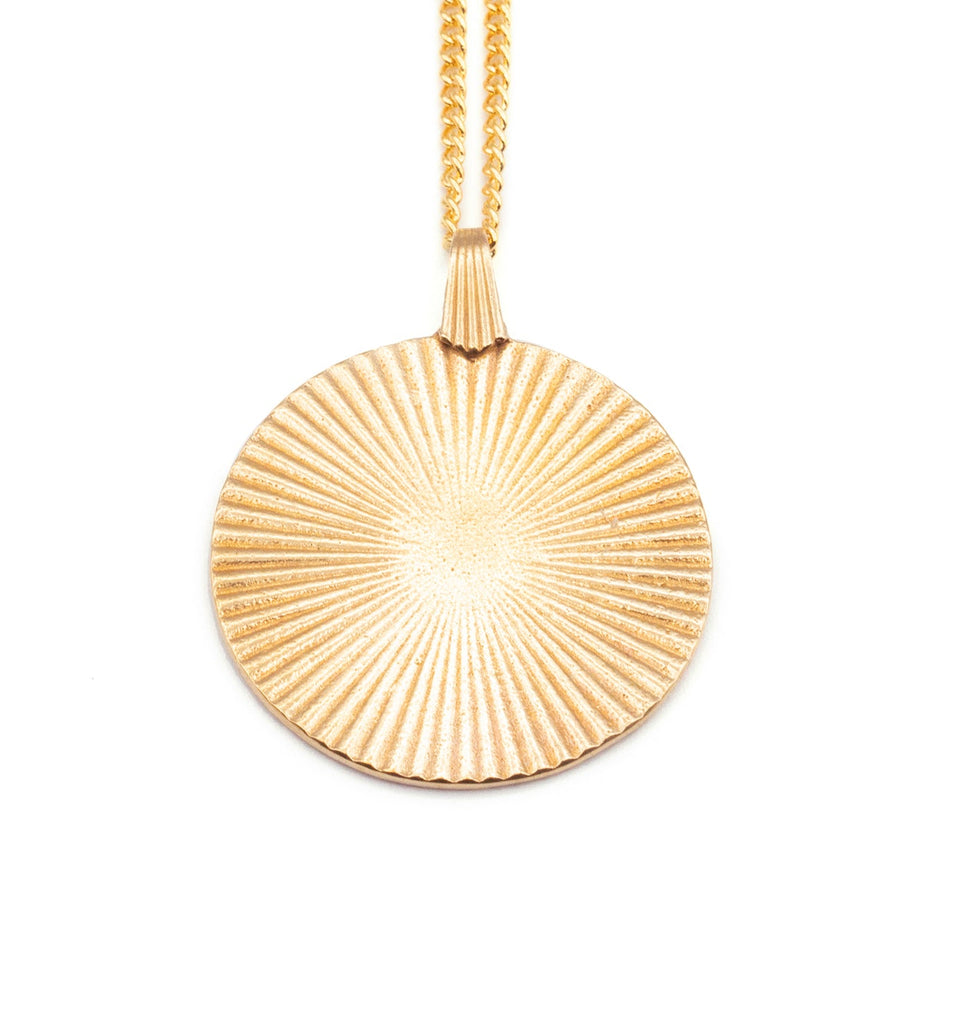 Introducing the Vintage-Inspired Gold Sunburst Pendant Necklace. This elegant gold disc features a sunburst design, gracefully suspended from a 21" chain. Choose between a 14K Gold Plated Curb Chain or a 14K Gold Filled Link Chain for a touch of customizable sophistication.